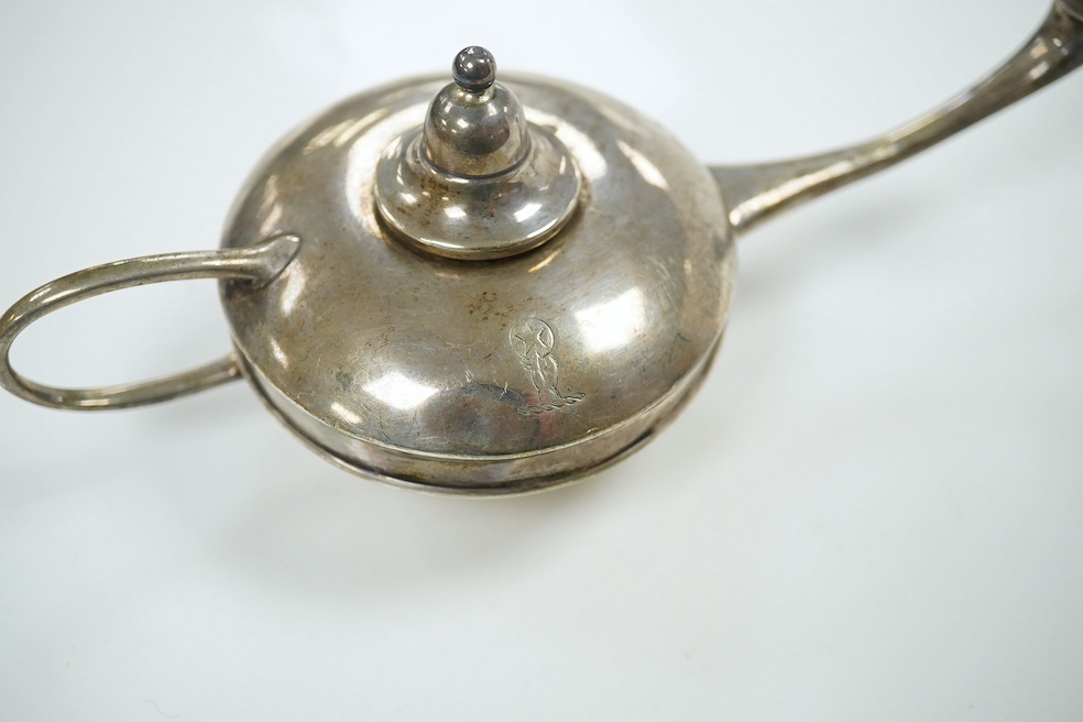 A group of assorted small silver comprising a George III helmet cream jug, a George V oil lamp cigar lighter, two stamp cases (6.5 oz), a white metal bowl stamped silver, an Indian white metal measuring cup, a small brus